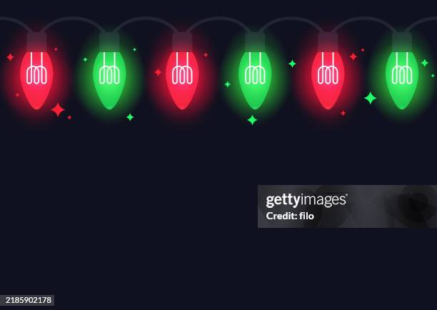 seamless glowing red green christmas holiday lights background border edge design element - light bulb frame stock illustrations