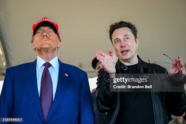 Elon Musk speaks with U.S. President-elect Donald Trump as they watch the launch of the sixth test flight of the SpaceX Starship rocket on November...