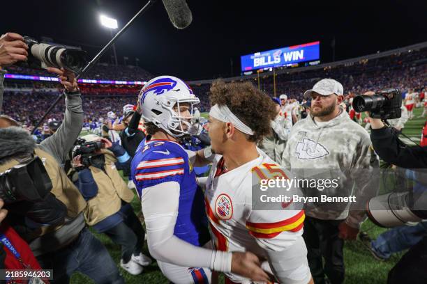 Josh Allen of the Buffalo Bills and Patrick Mahomes of the Kansas City Chiefs embrace after a game at Highmark Stadium on November 17, 2024 in...