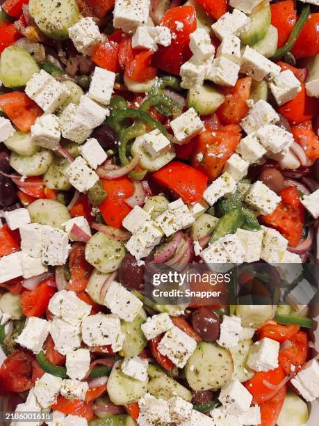 full frame close-up of a traditional greek salad - feta stockfoto's en -beelden
