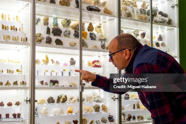 geologist examines a mineral sample - phosphate mineral stock pictures, royalty-free photos & images