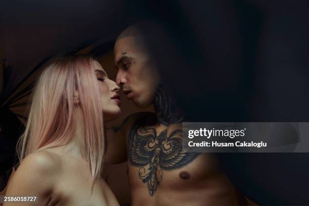 a young couple having a romantic moment. - turkey tattoos stock pictures, royalty-free photos & images