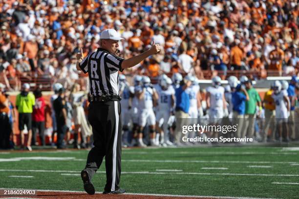 The referee gives two thumbs up to both sidelines after a television timeout of the SEC college football game between Texas Longhorns and Kentucky...