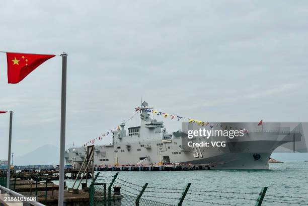 Chinese People's Liberation Army Navy formation consisting of the Hainan amphibious assault ship and the Changsha missile destroyer docks at the...
