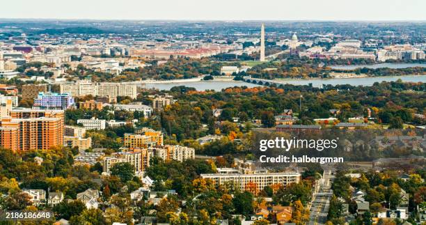helicopter shot looking across residential neighborhood in arlington, va towards dc landmarks - virginia capitol stock pictures, royalty-free photos & images