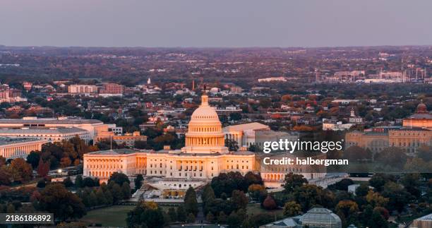evening sunlight on u.s. capitol and supreme court - aerial - capitol hill stock pictures, royalty-free photos & images