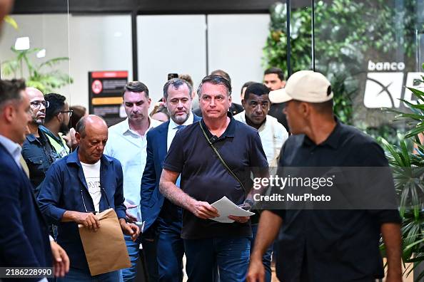 Former Brazilian President Jair Bolsonaro speaks to the press after ...