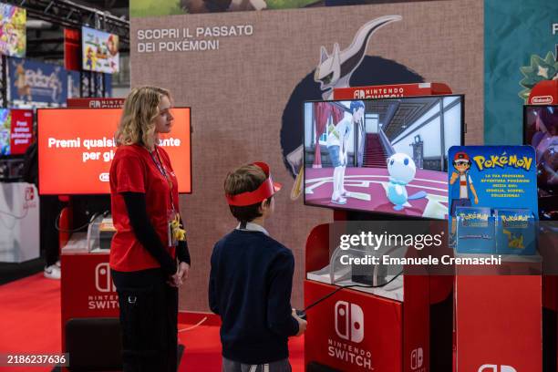 Child play video games at the Japanese publisher Nintendo Switch's stand during Milan Games Week & Cartoomics 2024 at Fiera Milano Rho on November...