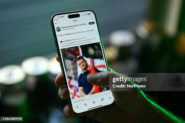 Post with an image of far-right activist and anti-Islam campaigner Tommy Robinson is seen in this illustration photo taken in Warsaw, Poland on 26...