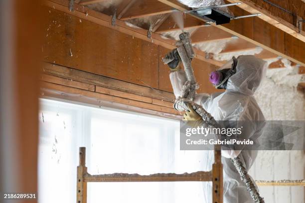 man working on house insulation - insulation stock pictures, royalty-free photos & images