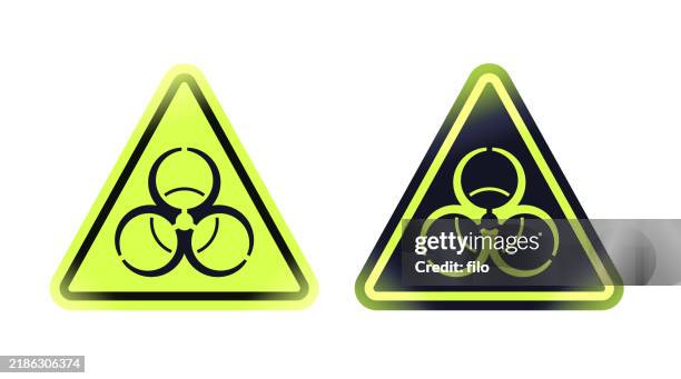 biohazard dangerous substance warning danger alert neon yellow green and black badge symbol - biohazard symbol stock illustrations