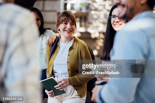 Happy Students Socializing Outdoors on a Sunny Day Happy Students Socializing Outdoors on a Sunny Day