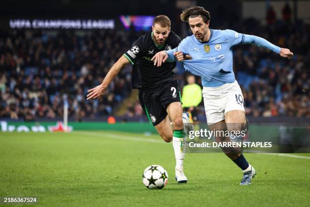 Feyenoord's Dutch defender Bart Nieuwkoop fights for the ball with Manchester City's English midfielder Jack Grealish during the UEFA Champions...