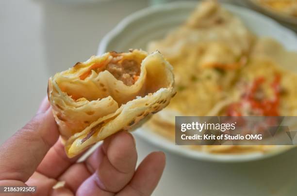 flatbread rolls with missing bites, homemade recipes - stuffed paratha stock pictures, royalty-free photos & images