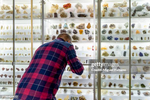 geologist examines a mineral sample - phosphate mineral stock pictures, royalty-free photos & images