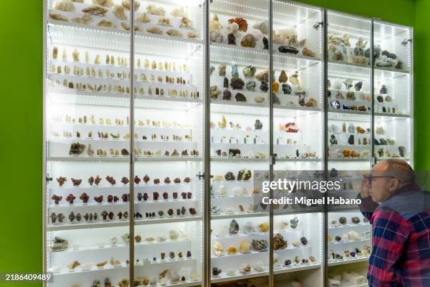 geologist examines a mineral sample - calcite stock pictures, royalty-free photos & images