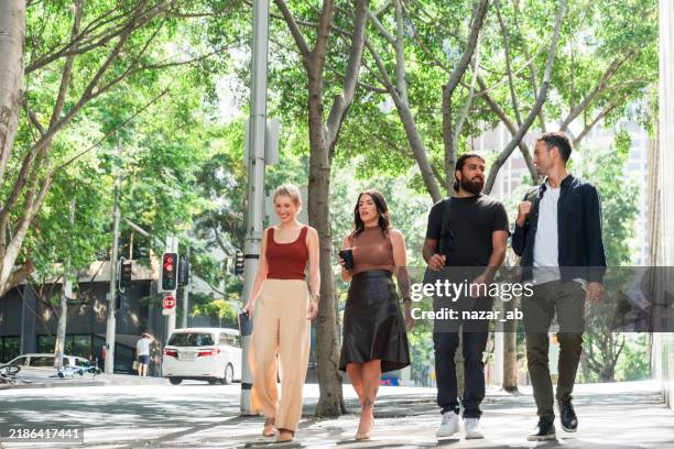 city stroll with colleagues. - australian culture stock pictures, royalty-free photos & images