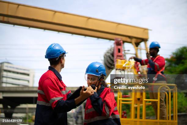 engineers are working at construction site. - three elevators stock pictures, royalty-free photos & images