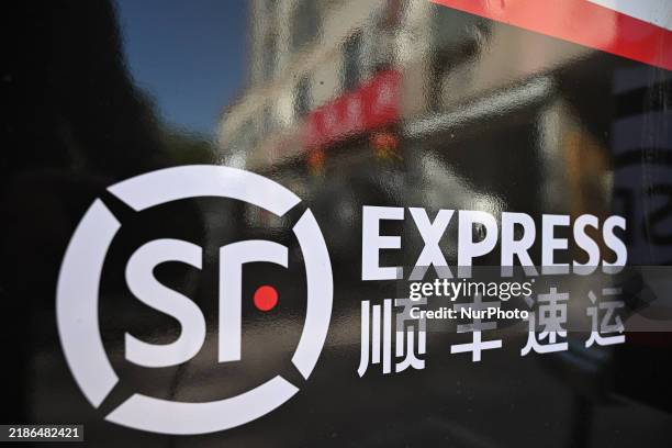 An express delivery vehicle is at the gate of an SF Express station in Nanjing, China, on November 27, 2024.