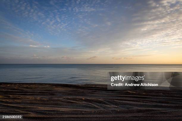 Nearly 120,000 tonnes of shingle is moved annually on the beaches near Folkestone from one end of beaches to the other to sure up sea defences to...