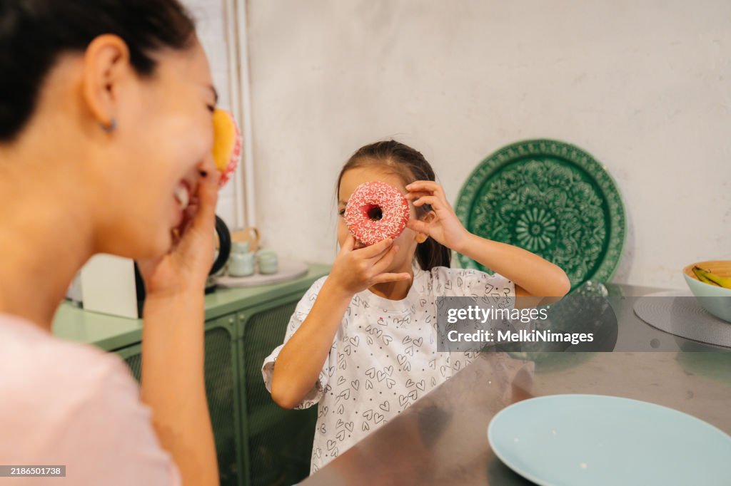 Sweet Moments , fun and eating donut in the kitchen