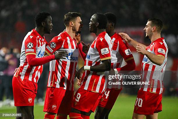 Crvena Zvezda Beograd's Bosnian midfielder Rade Krunic celebrates with teammates after scoring his team's second goal during the UEFA Champions...