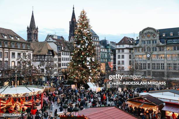 This photograph shows a general view of a giant Christmas tree , as visitors gather at Kleber square, on the opening day of the traditional Christmas...