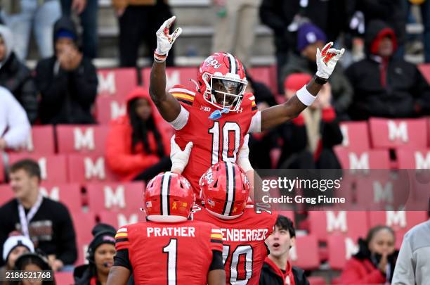Tai Felton of the Maryland Terrapins celebrates with teammates after scoring a touchdown in the fourth quarter against the Iowa Hawkeyes at Capital...