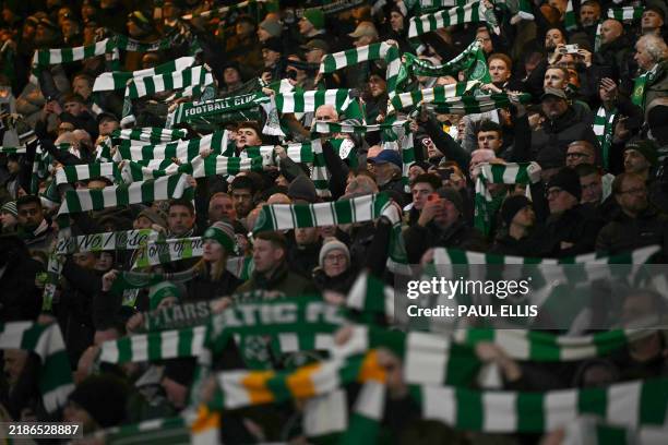 Celtic fans react ahead of the UEFA Champions League football match between Celtic and Club Brugge at Celtic Park stadium in Glasgow, Scotland on...