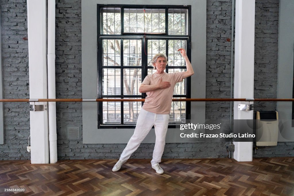 Senior man practicing tango in a dance studio