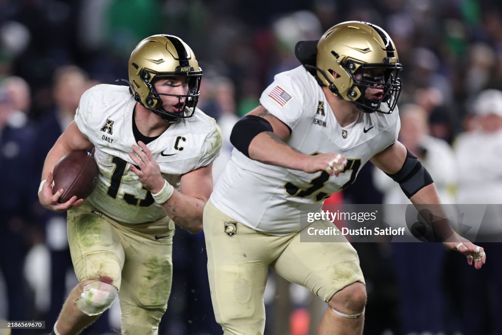 Bryson Daily of the Army Black Knights carries the ball behind a ...