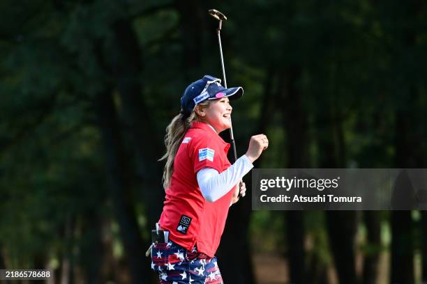 Shiho Kuwaki of Japan celebrates winning the tournament on the 18th green during the final round of JLPGA Tour Championship Ricoh Cup at Miyazaki...