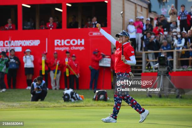 Shiho Kuwaki of Japan celebrates winning the tournament on the 18th green during the final round of JLPGA Tour Championship Ricoh Cup at Miyazaki...