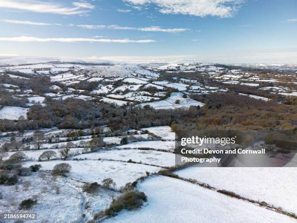devon's rolling hills under a blanket of snow - devon snow stock pictures, royalty-free photos & images