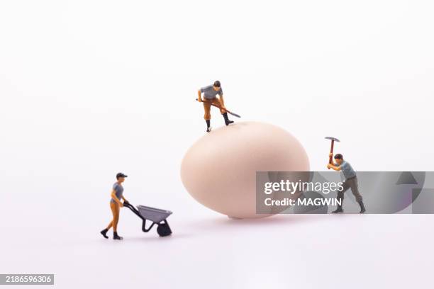 figurine working with egg - mini eggs stock pictures, royalty-free photos & images