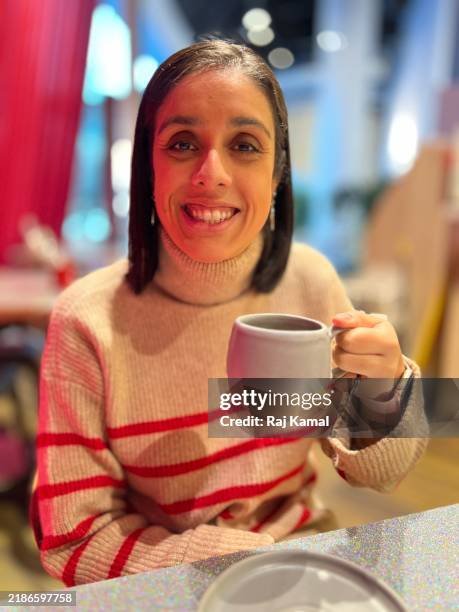 woman drinking hot coffee - young indian woman portrait stock pictures, royalty-free photos & images