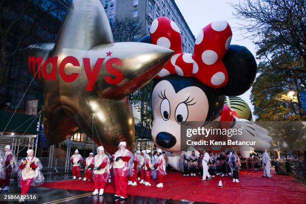 Revelers gather as rain falls before the Annual Thanksgiving Day Parade on November 28, 2024 in New York City.