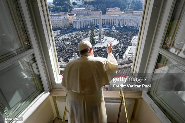 Pope Francis waves to the faithful gathered in St. Peter's Square during his Sunday Angelus blessing on the World Youth Day on November 24, 2024 in...