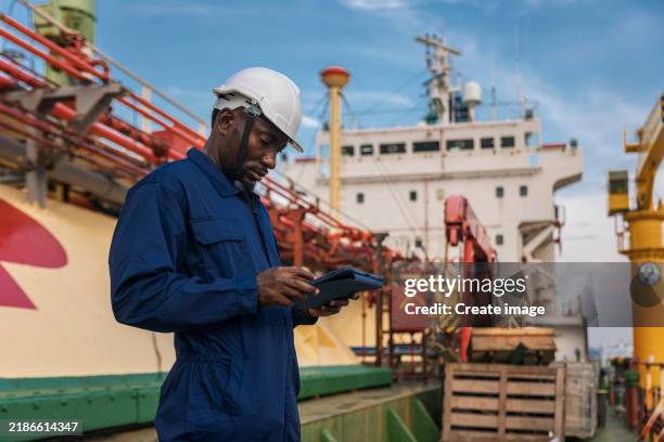 engineer crew working on oil ship tanker desk for business logistics import export shipping or freight transportation. - oil tanker ships stock pictures, royalty-free photos & images