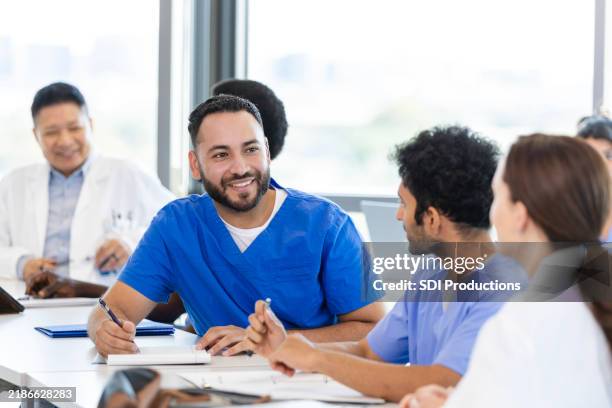 diverse healthcare professionals attend medical conference - male medical student stock pictures, royalty-free photos & images