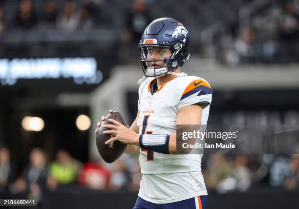 Quarterback Zach Wilson of the Denver Broncos warms up prior to a game against the Las Vegas Raiders at Allegiant Stadium on November 24, 2024 in Las...