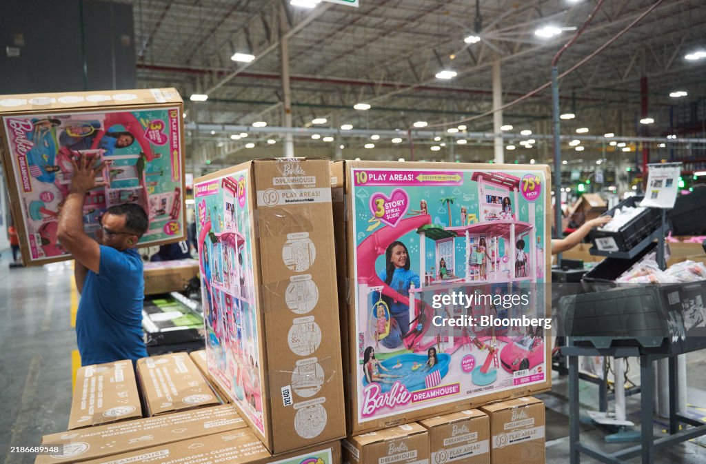 Mon Toi A worker carries a Barbie Dream House box at the Mattel Inc. Montoi ...