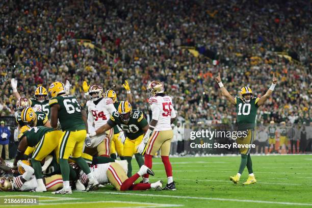Jordan Love of the Green Bay Packers celebrates after scoring a touchdown in the second quarter against the San Francisco 49ers at Lambeau Field on...