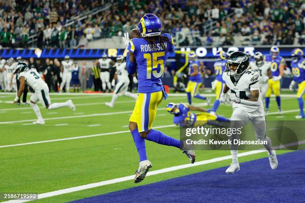Demarcus Robinson of the Los Angeles Rams catches a touchdown pass against Isaiah Rodgers of the Philadelphia Eagles during the third quarter at SoFi...