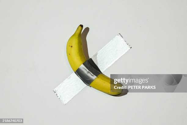 Banana artwork composed of a fresh banana stuck to a wall with duct tape is seen before being eaten by Chinese-born crypto founder Justin Sun in Hong...