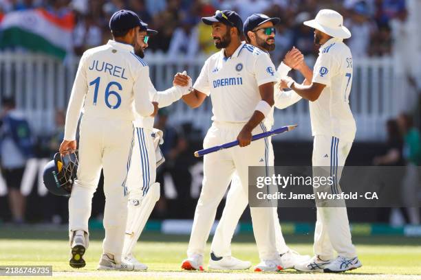 Jasprit Bumrah of India shakes hands with his team mates after the win during day four of the First Test match in the series between Australia and...