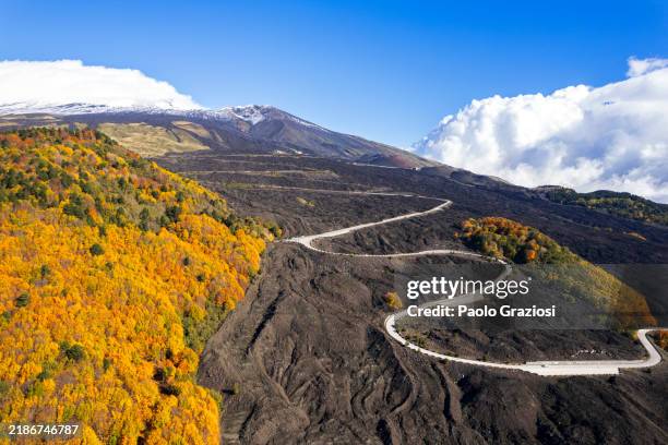 winding road to the volcano etna, drone view - sicilië stockfoto's en -beelden