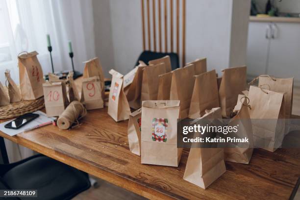 preparing an advent calendar, craft gift bags - belarus stock pictures, royalty-free photos & images