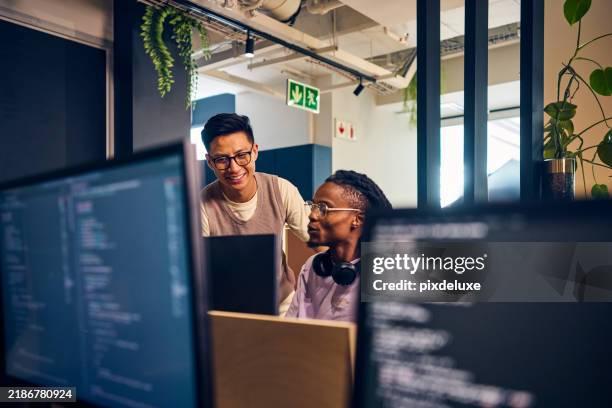 software developers working together on code in modern office - web designer imagens e fotografias de stock