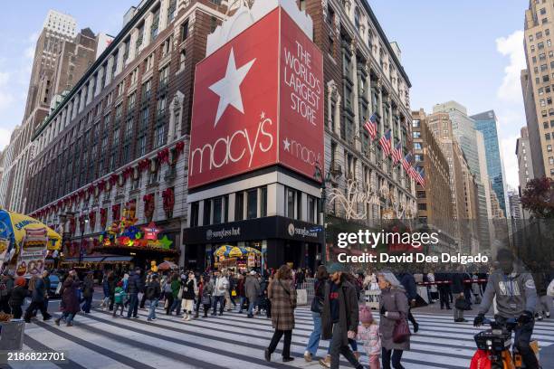People walk past the Macy's Herald Square flagship store on November 29, 2024 in New York City. Black Friday sales will give economists a glimpse...